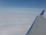 Fluffy clouds at cruising altitude
